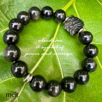 Obsidian bracelet crafted with lion charm, a symbol of power and courage